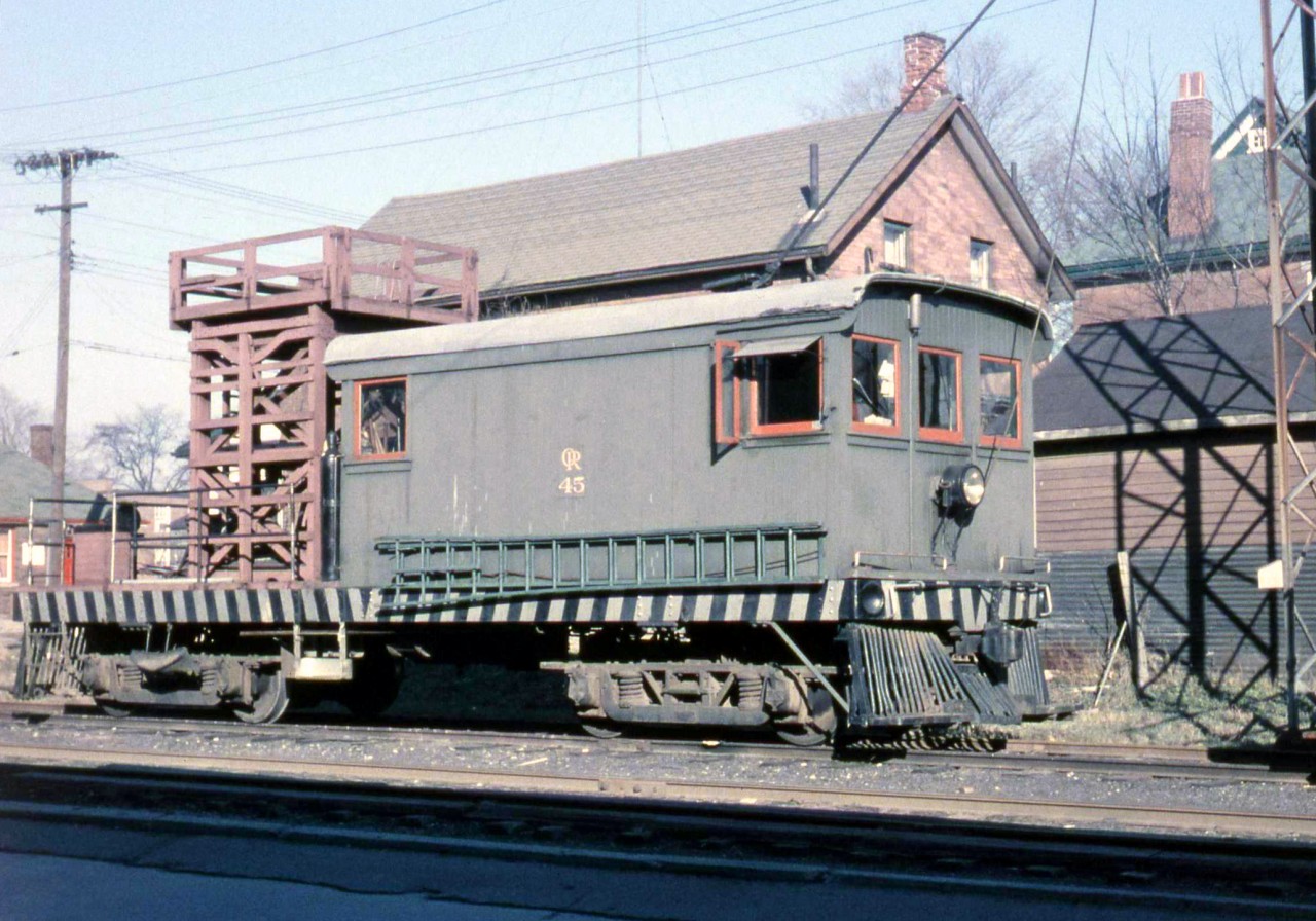 The last for now of our look at the now-vanished Oshawa Railway electric line, we find OR line car 45, used for overhead maintenance work on the electric catenary wire, parked behind 44 halfway up the line south of the shops. This car was built in 1925 by the Niagara, St. Catharines and Toronto Railway, another CN Electric Lines operation, and was transferred to the Oshawa Railway where it worked until the line was de-electrified in 1964. CN donated it in 1964, and it is now restored and in operating condition at the Halton County Radial Railway museum in Rockwood ON.