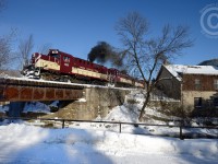 <b>Originals</b> - the Original bridge, built in 1888 for the Guelph Junction Railway at the site of Allan's mill, while a trio of Montreal Locomotive Works originals cross over the Speed River. This bucolic scene has changed little, except the operating Railway from Canadian Pacific to Ontario Southland in 1998. However, this site is to change significantly over the next year or two - a new railway bridge is scheduled to be installed, as it has reached end of life. Condos (highrises - a total of four!)) will go up left, centre and right - behind the mill buildings in the background, and a new pedestrian bridge will be attached to the Railway bridge or built adjacent to it. The railway will bisect the condo development, which will make for interesting photo opportunities in a few years time, but this scene is now on borrowed time.
