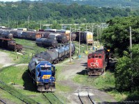 Working the Stuart Street yard in Hamilton, Southern Ontario Railink GP38-2 3873 shuffles a cut of tank cars around on a sunny day, surrounded by all the lush greenery of the waterfront. Starting out her career on the Maine Central railway (MEC), 3873 previously worked on RailAmerica's Ottawa Valley Railway as their 2000 before coming here. Parked a few tracks over is another GP38-2, CN 4776 (GP38-2W), which along with GP9RM 4121 is being leased from CN for use by SOR.