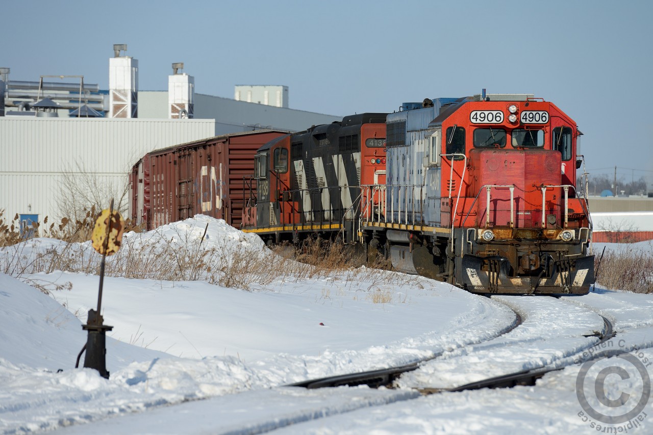 Foreign Power rarely makes it onto Local trains in Canada, but sometimes it does... witness this find in Brampton Ontario on the Glass Lead , GTW 4906 having point duty while boxcars are switched out of Zochem.