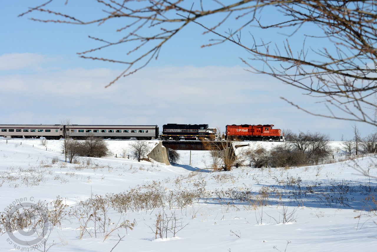 The OBRY's Credit Valley Explorer is southbound in Snelgrove Ontario with a compliment of CP inspired equipment trailing the power (including a dome car, not pictured). Due to mechanical malfunction of the 4009 - CP 8249 has been assigned to the OBRY until the 4009 is fixed, making for an interesting photo of a double-headed train, rare for a railway that has only ever had two engines assigned to it. I believe this is the first time a CP unit has been on the Explorer tourist train though - if you know differently, please say so in the comments below! All corrections welcome. You could ride behind this CP Geep if tickets are available for upcoming runs - book your ticket at http://www.creditvalleyexplorer.com/
