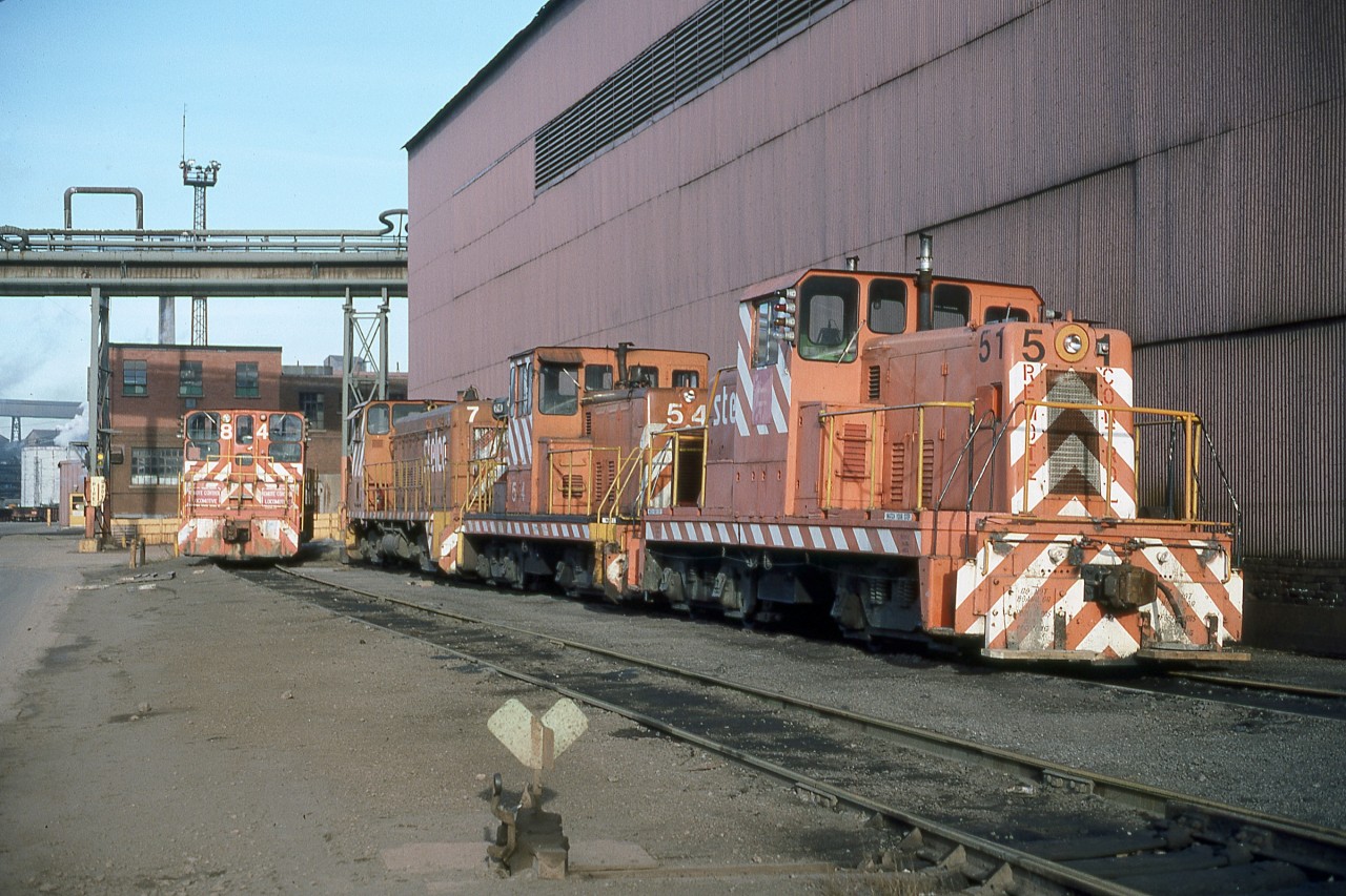 The quartet of locomotives shown includes every type of unit rostered by Stelco at the time. Featured in the foursome are the following models:
No. 51 - GE 65 Ton, built April 1950 (ballasted to 80 Tons)
No. 54 - GE 80 Ton, built May 1952
No. 74 - GMD SW8, built April 1953
No. 84 - GMD SW900, built November 1959
At the time the venerable GE center cabs were not active and considered to be ‘spares’.