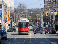 Rolling through the sunny streets of downtown Toronto, TTC CLRV 4103 cruises westbound along Dundas Street after stopping at Church. Traffic, both on rubber soles and and on rubber tires, goes about its late afternoon business.
<br><br>
It's amazing in a way all the different areas and neighbourhoods a streetcar in Toronto can pass through from one end of its route to the other; take this particular section of the 505 for example. While the ever bustling and commercialized Dundas Square is behind us along with the Eaton Centre, and further to the west there's lots of suit spillover from Bay Street and University Avenue, the kink in Dundas after Victoria and the tall buildings isolate this quieter section of Dundas nicely. Calmer and less busy, the stores lining both sides see a moderate amount of foot traffic from the neighbouring Ryerson University and its residences. Another curve in the distance arcs Dundas St. to Sherbourne, and through the more seedier neighbourhood of Moss Park. Generally safe during the day, once you pass Filmore's Hotel just around the bend it's best to proceed with caution all the same, and use discretion when walking around with a camera.