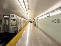 Heading westbound in the evening, TTC 5911 trails a train of sister H6 cars at Woodbine Subway Station, loaded with passengers heading for points west as well as the Yonge, University and Spadina subway lines. The evening flow from the downtown core is in the opposite direction (eastbound) on is part of the Danforth line, leaving us plenty of empty seats for our ride back downtown. This station was the original eastern end terminus of the Bloor-Danforth subway line, that ran from Keele to Woodbine and opened in 1966. This was short-lived, as a 1968 expansion would see the end terminal points pushed further out to Islington and Warden respectively.