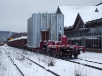 A 725,000lb electrical transformer gets underway at the North Bay station after a long ordeal in the yard. Firstly, The lead units waere supposed to be 1735 and 1804 but 1735 wouldn't start so they used SD75i 2103 Instead. After they replaced The power with 2103, They found that their load would not clear a switch stand in the yard and MOW crews had to remove the switch stand. Once this transformer got to Porquis Junction, The power was switched out for GP40-2 2200 in order to bring the transformer along 6 miles of track that hasn't been used since the 80's. The Transformer is loaded on Depressed Center Flat KRL 300304 and it is destined for Hallnor substation outside of Timmins Ontario.