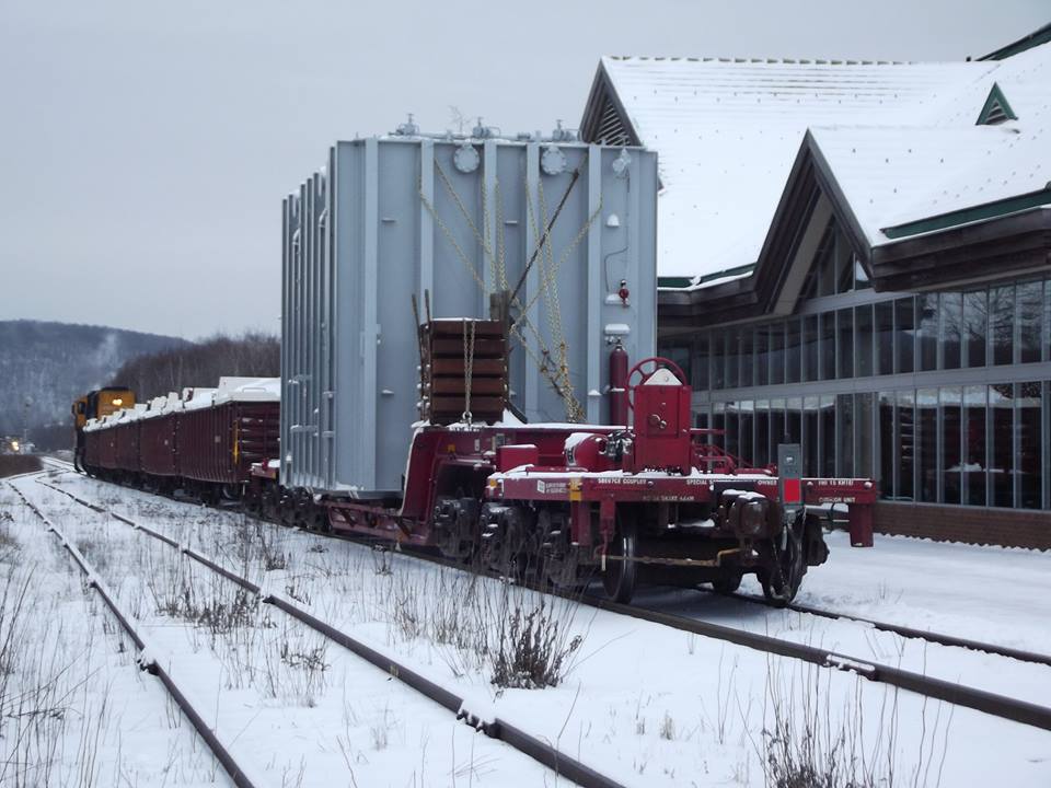 A 725,000lb electrical transformer gets underway at the North Bay station after a long ordeal in the yard. Firstly, The lead units waere supposed to be 1735 and 1804 but 1735 wouldn't start so they used SD75i 2103 Instead. After they replaced The power with 2103, They found that their load would not clear a switch stand in the yard and MOW crews had to remove the switch stand. Once this transformer got to Porquis Junction, The power was switched out for GP40-2 2200 in order to bring the transformer along 6 miles of track that hasn't been used since the 80's. The Transformer is loaded on Depressed Center Flat KRL 300304 and it is destined for Hallnor substation outside of Timmins Ontario.