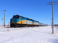 VIA's 693 departs Portage for Dauphin on a sunny yet very cold afternoon.