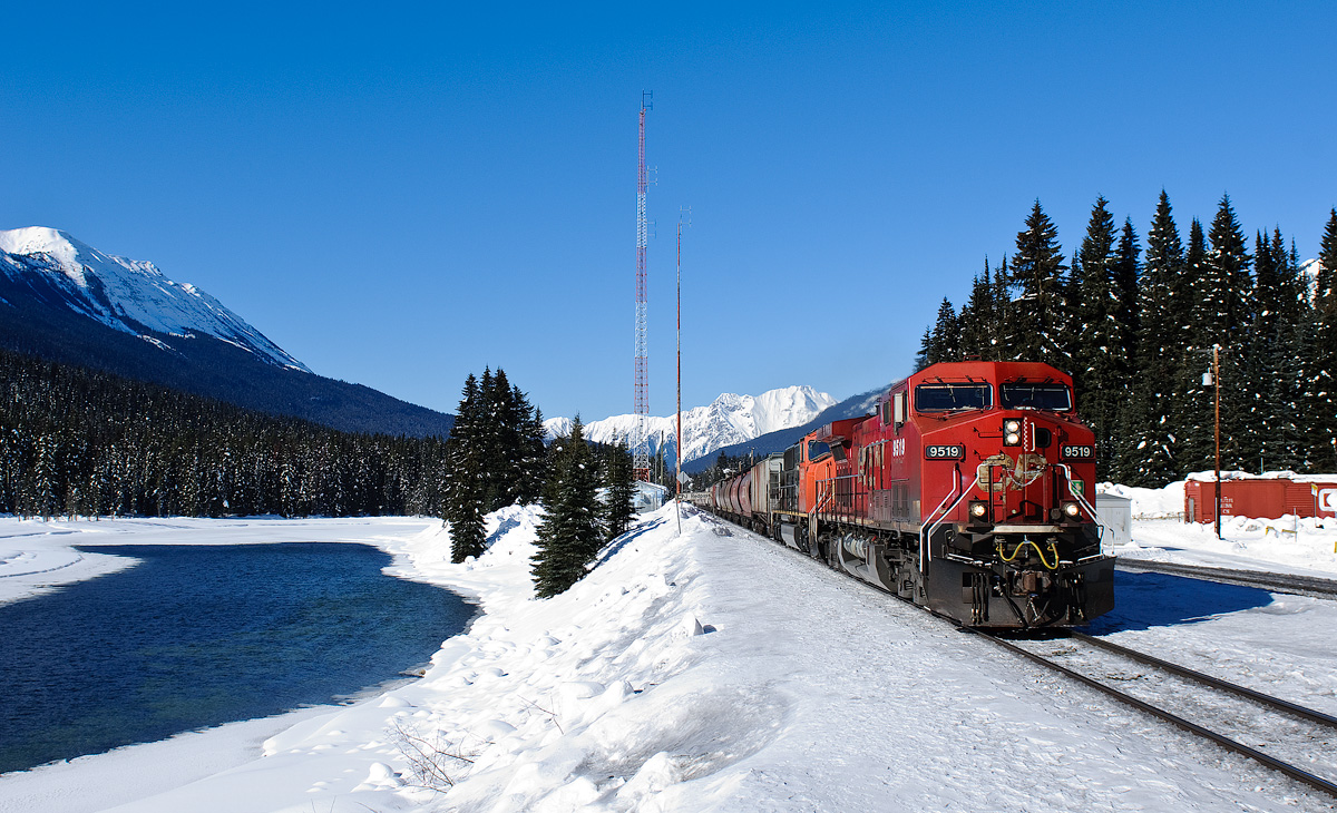 CP AC4400CW 9519 and CN SD75I 5689 speed through Redpass at 45mph with 49 grain empties for Grande Prairie, AB and 111 coal empties for the Powder River Basin in Wyoming.