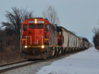 CN train A439, arriving into the outskirts of Windsor, in Lakeshore, Ontario. GTW 4927 & CN 4700 lead a 30ish Car train, pass the Hiram Walkers Warehouse's, and you can also see where the old second Main was. 
