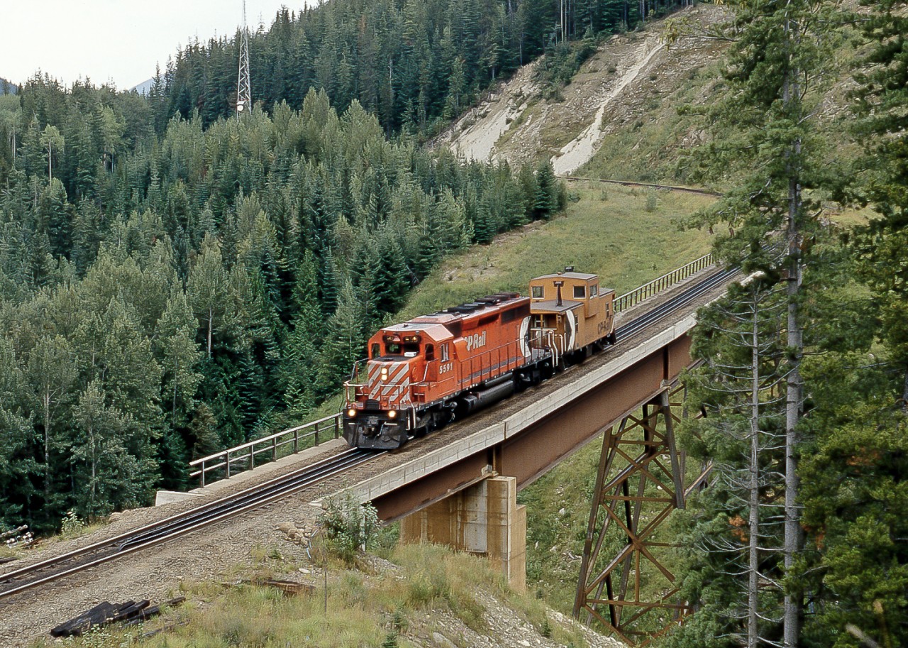 Another view of Mountain Creek Bridge with SD40-2 CP 5591 making a "caboose hop" down the grade