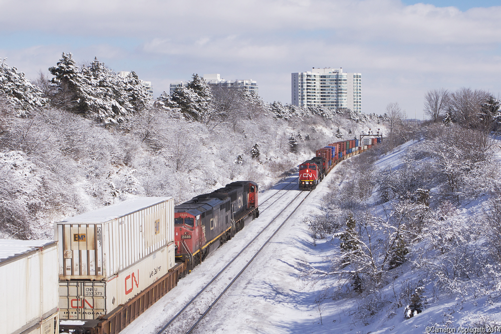 CN Q102 west meets Q105 at Hilda Ave on the York Sub in a positively fabulous winter wonderland.