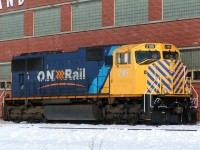 Ontario Northland SD75I #2105 sit's outside the North Bay diesel shops shining in the sun. The unit was in a logging truck accident back in dec of 2012 and after a year in the shops it was released with a new nose job and safety strips. 