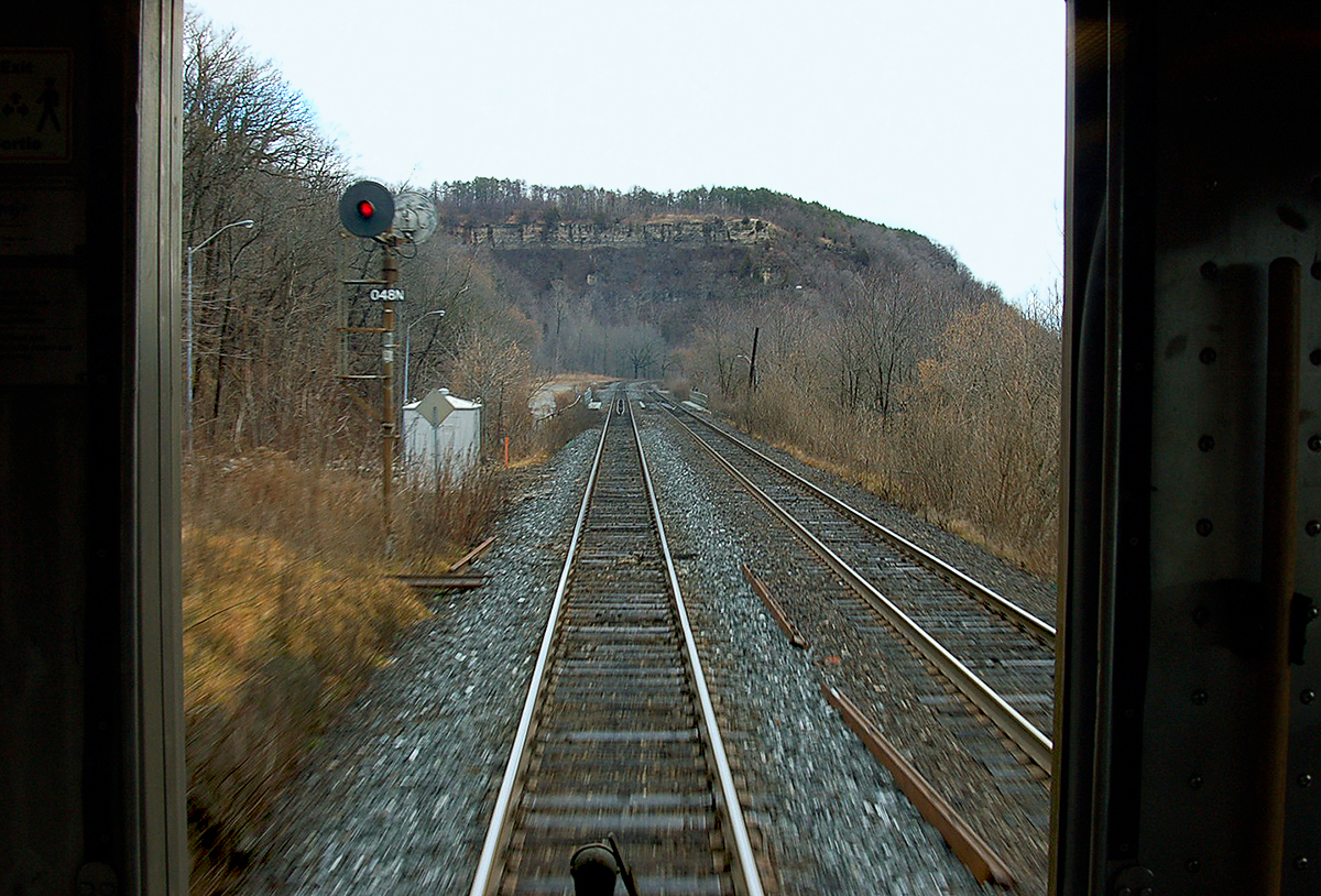 The only way to travel. Onboard VIA Toronto-Windsor train #73. View from rear of train as it climbs the Niagara Escarpment past the foot of Dundas Peak at Dundas, ON. For more pics & videos from my collection see my website at  http://northamericabyrail.info  (New trips added)