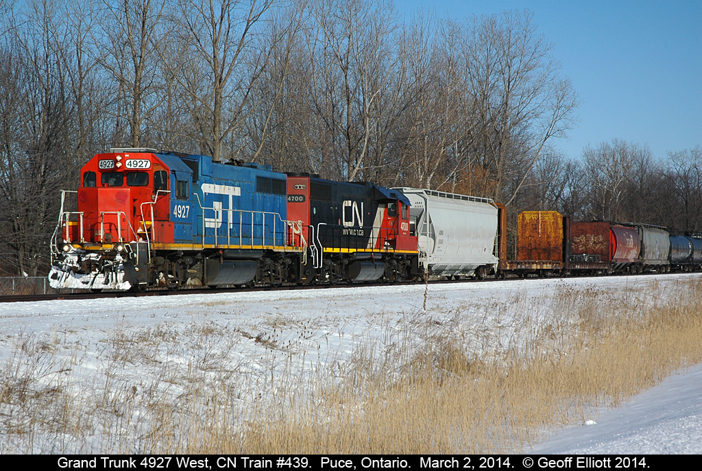 A rare catch as blue Grand Trunk GP38-2 #4927 leads CN train #439 down the VIA Chatham Subdivision on a sunny, but cold, March 2nd, 2014 day.  Sad to see all the old predecessor railway schemes fade off into oblivion, but nice to catch one while they still exist!!