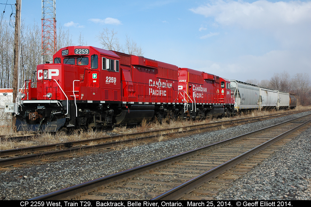 CP Train T29-25, having run out of time due to MOW crews working on the main between Tilbury and Chatham, ties up on the back track in Belle River on March 25th, 2014.  The train was to be lifted by a westbound later that evening, however this plan changed as the crew didn't want to make all the moves necessary to make the lift out of the back track.  The RTC agreed and as a result T29 was called at 0700 on the 26th and crewed the train in Belle River.  They then proceeded to Windsor, dropped the cars in the photo, made their lift and headed back to Chatham.  Ironically they didn't make it back on the 26th either and ended up in the same place you seem them here.....