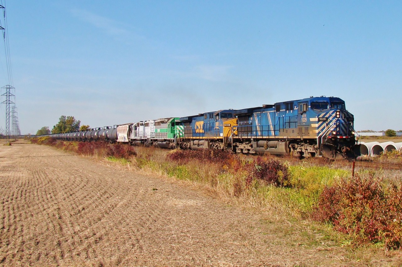 A loaded ethanol train speeds eastbound out of Windsor with a nice non-CP latchup.