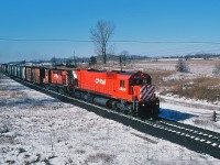 ...Yes, in other years it has snow-ed in March....
<br>
<br>
...on a bright and very chilly Sunday morning a pair of MLW's lead CP Rail #942  at the Newtonville Road bridge.
<br>
<br>
Second generation MLW M630 4560 is assisted by an unidentified first generation RS-18.
<br>
<br>
March 2, 1980 Kodachrome by S. Danko.
<br>
<br>
More big M's

<br>
<br>
<a href="http://www.railpictures.ca/?attachment_id=7082">  at Bolton </a> 
<br>
<br>
<a href="http://www.railpictures.ca/?attachment_id=6317">   Agincourt west </a> 
<br>
<br>
<a href="http://www.railpictures.ca/?attachment_id=2098"> at Leaside </a> 
<br>
<br>
<a href="http://www.railpictures.ca/?attachment_id=1864">   at Staines </a> 
<br>
<br>
<a href="http://www.railpictures.ca/?attachment_id=1863">  departing Agincourt east </a> 
<br>
<br>
<a href="http://www.railpictures.ca/?attachment_id=1759">  trio departing Agincourt east </a> 
<br>
<br>
<a href="http://www.railpictures.ca/?attachment_id=12276"> the biggest M  </a> 
<br>
<br>
sdfourty.
