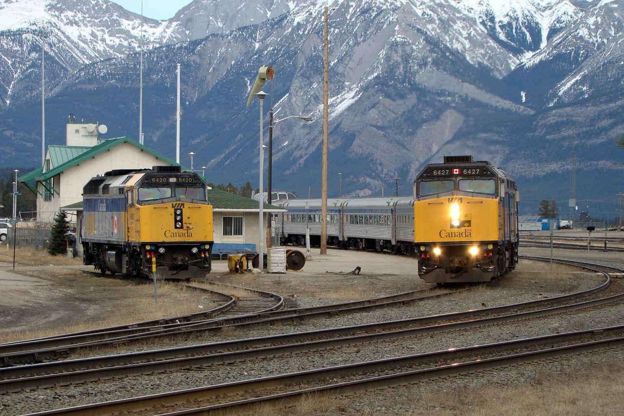 VIA 6427 and 6405 depart Jasper heading west with VIA train #1 "The Canadian" while 6420 sits in the siding waiting to be called on if required.