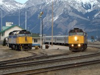 VIA 6427 and 6405 depart Jasper heading west with VIA train #1 "The Canadian" while 6420 sits in the siding waiting to be called on if required.