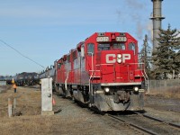 GP38-2's CP 3082 and 3034 switch tank cars at CP's Clover Bar Yard