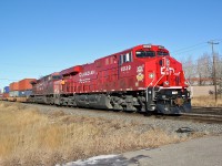 ES44AC CP 8939 carrying a crest honoring the Lord Strathcona's Horse Royal Canadian Armoured Regiment of the Canadian Forces heads east away from CP Alyth Yard in Calgary.  The second loco is AC4400CW CP 9678.