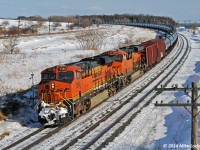 BNSF 7284 and 6568 lead CN 711 through the curve at Lovekin. 1451hrs.