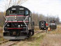 Upon arrival at Snelgrove in northern Brampton, it's time to put a unit on the rear of the Credit Valley Explorer tour train for the return trip north. Here the crew has uncoupled the power, run it ahead, cut off 1000 and is backing onto the siding around the train to hook onto the rear. Once 4009 was reconnected, the CVE would keep heading south to tour the rest of the Orangeville Brampton Railway line, and then reverse direction at Streetsville with 1000 leading north and 4009 trailing. <br><br> The community of Snelgrove, located at the northern edge of urban sprawl in Brampton, apparently got its name due to a large number of people with the last name "Snel" (or Snell) living in the area. While there once was a station here along the Credit Valley Railway line (later CPR, today OBRY), it is long gone. Only the siding and back track remaining here (sometimes used for running around trains, setting off cars, storing work equipment and transloading shipments).