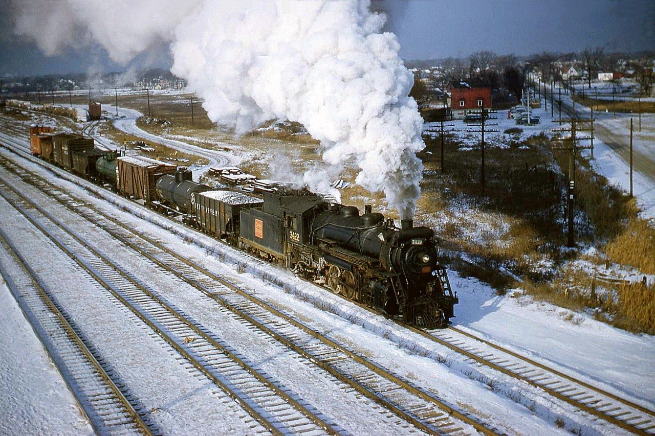 The CN Stratford Wayfreight with 2-8-2 Mikado 3422 leaves Sarnia on December 1958. It would head up the now-removed Forest Subdivision at Sarnia Junction (just behind us, to the east of Indian Road) and on to Stratford.