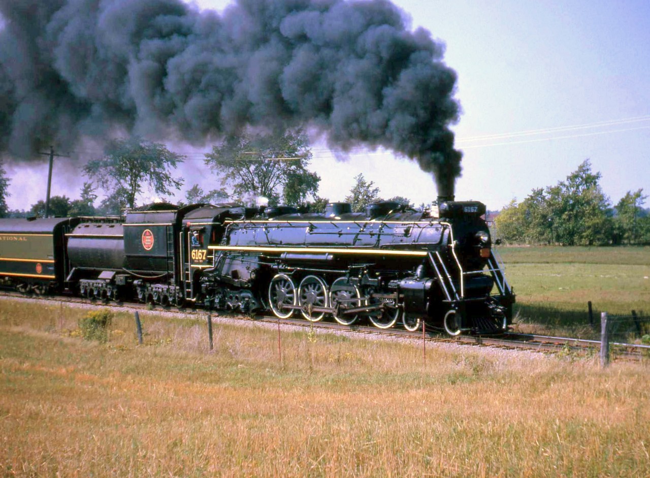 One of the CN steam excursions trips I enjoyed the most was UCRS excursion to Belleville and then to Picton-Prince Edward County, with 4-8-4 Northern 6167. It's seen here with a good head of steam approaching Picton ON, on the CN Marmora Sub (that ran from Trenton Junction to Picton).

Geotagged location not exact