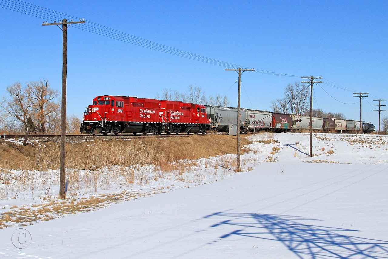 CP 2263 and CP 2259 with train T-29 make their way westward for Windsor at mile 73.6 on the CP's Windsor Sub.