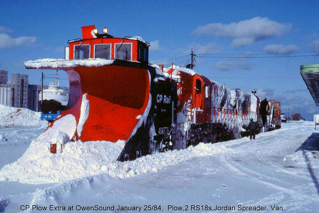 30 years ago when I was in Owen Sound and it had snowed the day before, I asked the CP operator if a plow train had been called for. He said one was working up from Orangeville. I spent some time looking for him but was only able to get a few distant shots along the line just as he was heading down the escarpment. Also one shot of a freight that was right behind him.   Shown here is the aftermath of the trip: CP plow 400778 (the regular assigned Orangeville/Owen Sound Sub plow) along with RS18's 8766 and 1814 caked with snow, a Jordan spreader, and van on the rear, all sitting at the station in Owen Sound.