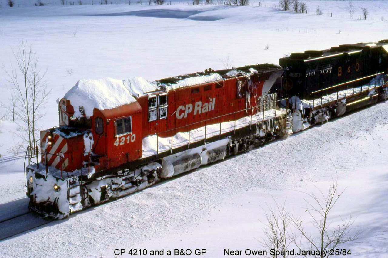 Following the behind the CP Plow extra in the previous photo, a snow-covered CP C424 4210 and leased B&O GP38 4803 head a northbound freight up the Owen Sound Sub, south of Owen Sound. Probably an extra freight as there's a white flag on the engineer's side of the lead unit; presumably snow drifts took the other one.