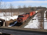 From the Denfield Road bridge CP 8648, with trailing clunkers CP 1690 and 1549, is westward with train 241-20 at mile 5.5 on the CP's Windsor Sub.