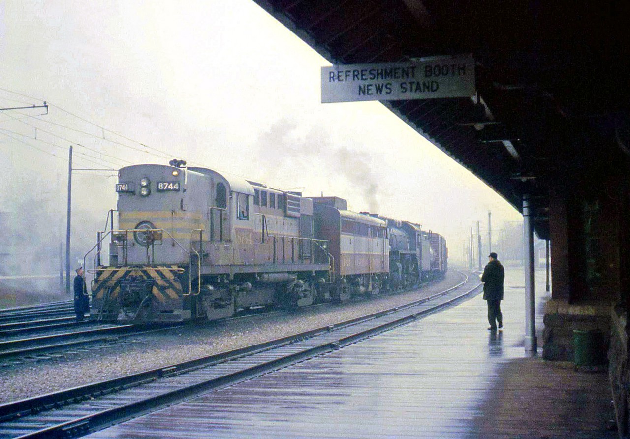 CP RS18 8744 and an FA1 help Mikado 5147 at Galt Station, on a rainy day in October 1959. The MLW-built 8744 was only two years old at the time, but the 5147, a P1-class 2-8-2 unit built in 1913 (also by MLW) was nearing the age of 47 and didn't have much longer - steam operations were quickly winding down in the late 1950's on Canadian Pacific.