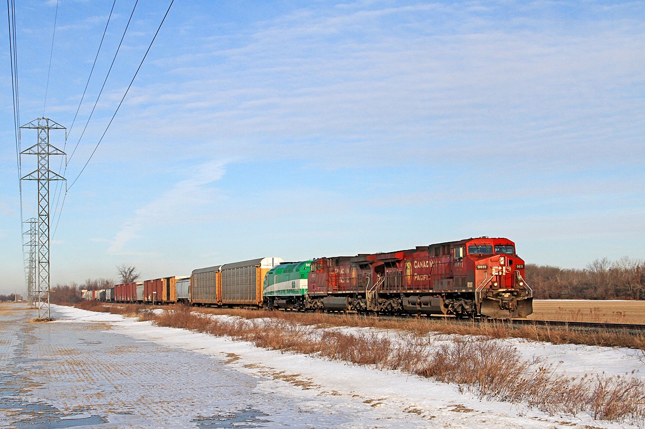 CP 9611-240, with CP 9807 and GO 661, is eastbound at mile 98.8 on the CP's Windsor Sub. Motive Power Inc./Wabtec at Boise swapped out GO's EMD 16-cylinder EMD 710GB prime movers on the MP40PH-3Cs with two Cummins QSK60s.