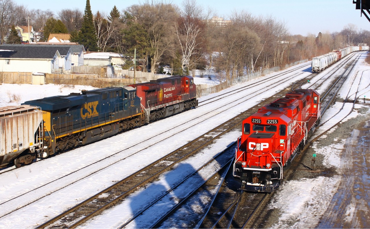 Today CP 608 came in with CP 9800 and CSX 937 assisting. On the Yard lead CP 2255 and 3038 pull out into the sunshine, just in time to make the shot interesting, while on their way to pick up a new cut of cars marshal.
