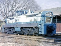 General Motors diesel-hydraulic switcher 600, a "GMDH-1", is seen here on trial on the Canadian Pacific Railway at St. Marys, Ontario in 1958. An experimental locomotive concept that never caught on, a total of four demonstrator GMDH-1 locomotives were built at GMD's London ON plant in the mid to late 50's, equipped with two large truck-sized diesel engines mated to a pair of hydraulic transmissions. GM's automotive department no doubt had a hand in the carbody styling. No orders were to follow from CNR, CPR or other railways, which were by then well into dieselizing their fleets (with the more popular diesel-electric locomotives). <br><br> Number 600 was the second unit built (serial number A1713, blt September 1958). Reports indicate it was later sold to a railway in Brazil and is now scrapped. The other three fared a little better:  while one was sold to a contractor and sent to Pakistan, the original demo 1001 resides at the Canadian Museum of Science & Technology (it had been the GMD London plant switcher for years). Another unit, after changing hands more than half a dozen times, remains active to this day at a petroleum company in Kaybob, Alberta. A single GMDH-3 was produced, essentially a smaller version (with only 3-axles and a single engine/hood), that now resides at a preservation society in southern Michigan. <br><br> <i>Geotagged location may not be exact.</i>