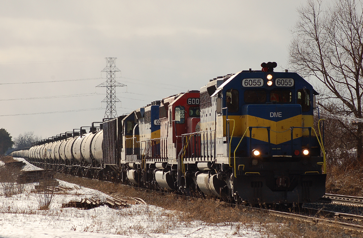 DME 6055 - CP 6009 - ICE 6211 lead 81 cars as they take the siding at Orrs Lake to meet CP 235