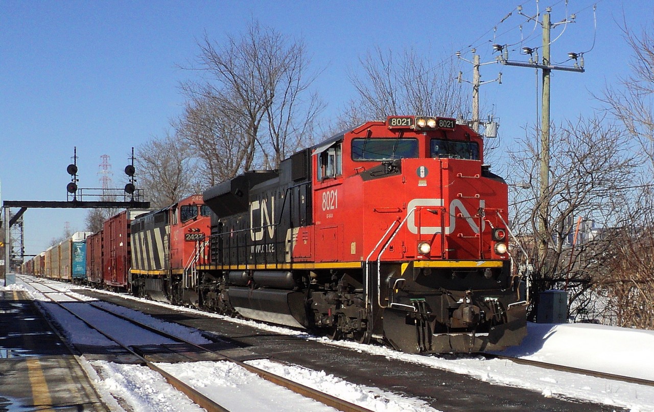 CN-8021 a SD-70-M2 leading loco on rte 310 to Joffre P.Q.with freights cars and gasoline cars passing by ST-Lambert