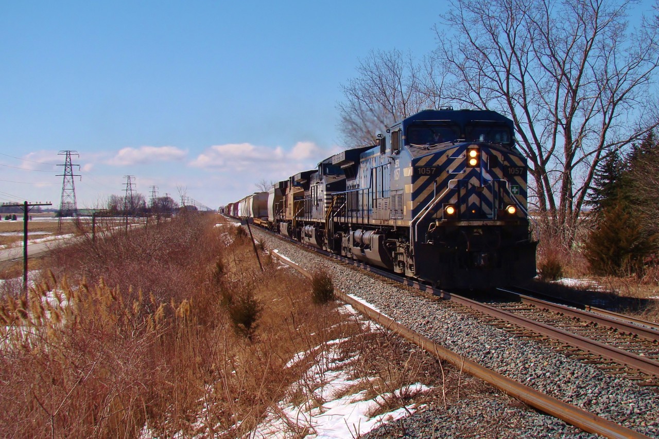 CEFX 1057, NS 9387 & UP 7016 lead CP train 240 pass Merlin Rd. as they make their way through the never ending fields of southwestern Ontario.