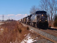  CEFX 1057, NS 9387 & UP 7016 lead CP train 240 pass Merlin Rd. as they make their way through the never ending fields of southwestern Ontario.