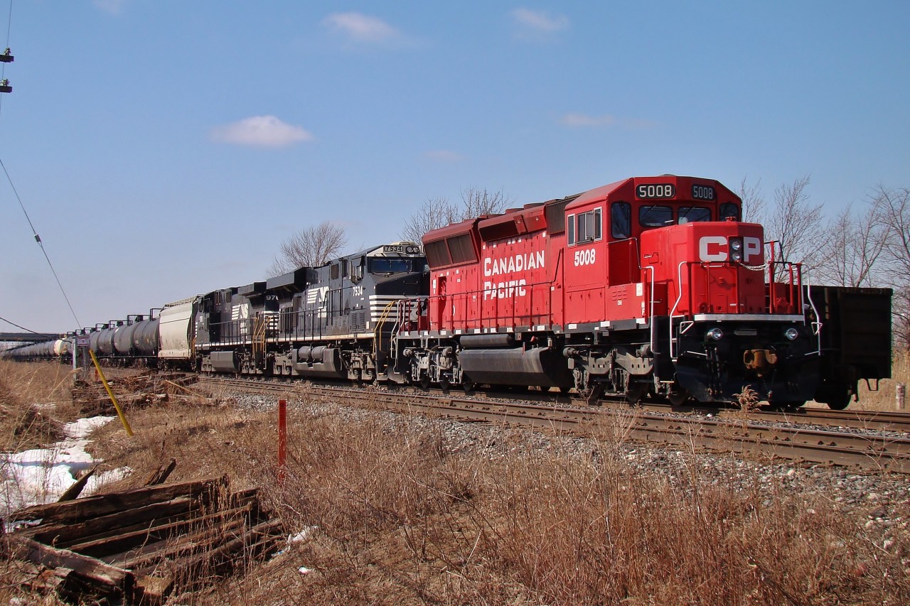 Sitting in the east end of the Walkerville siding, this loaded petroleum train sits quietly with all motors off waiting for a crew to take the 80 or so cars east for refining.