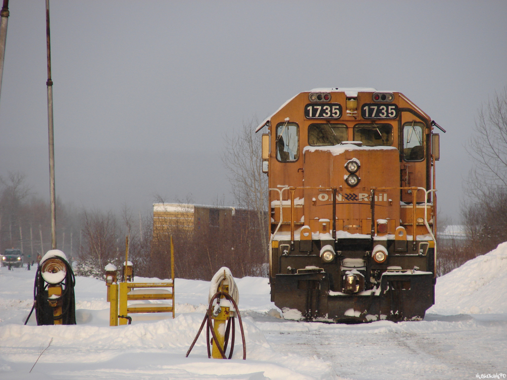 ONT 1735 sits between assignments at the shops shortly after sunrise during the early morning hours on December 23rd 2013, after several hours of regular blizzard night driving from further North.
