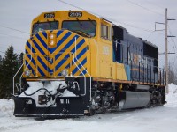 SD75I 2105 complete with her new 'safety stripes' rolls off the wye at Cochrane March 3rd.