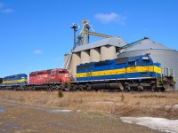 CP 644-904 passes the grain elevator at Haycroft with DME 6055 on the point with CP and ICE units trailing.