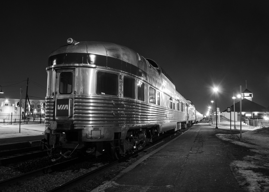 VIA 66 had two dome cars deadheading today. The rearmost dome is 8706 (Glacier Park), not sure about the other. Went to Dorval to take some shots of it during its quick station stop, a bit under an hour after sunset. Leading was VIA 6414. Thanks to Mathieu Tremblay for the great work in helping me process this difficult shot. For more train photos, click here.