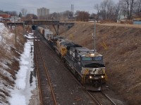 CP 240 emerges from the Detroit/Windsor tunnel led by NS 9387 & UP 7016 on this cloudy morning. CP 6256 was originally leading this train paired up with the UP but had a dynamic brake fire and was set off in Elkhart IN. The NS 9387 was put on as the new leader and continued on.