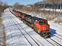CN 2552, CN 2613 & CN 2409 head east with CN 120 on a crisp winter day (in temperature if not in season). Thirty second later CN 710 would pass eastbound as well. For more train photos, click <a href=http://www.flickr.com/photos/mtlwestrailfan/>here.</a>