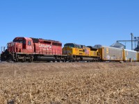 CP 235 passes by the grain elevator at Haycroft on its way towards Walkerville led by CP 5743 & UP 8640