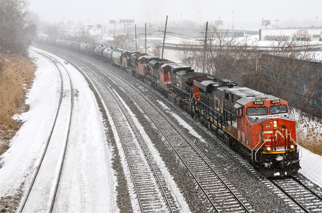 21,800 horsepower. With a snowstorm just beginning, a later than usual CN 305 heads west after a crew change at Turcot West with lots of power. Up front are 4 units (CN 2338, CN 2627, CN 8821 & CN 2235) and mid-train is CN 8849. For more train photos, click here.